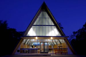 An image of The Abbey A-Frame facility at twilight